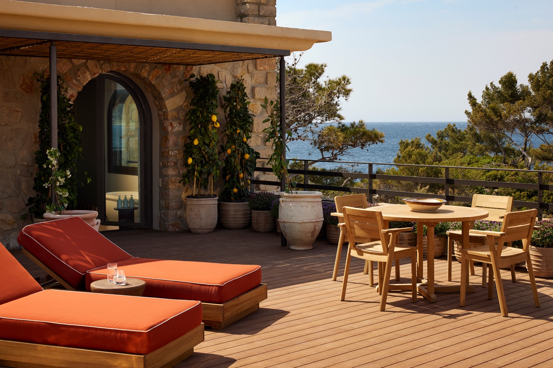 The Delos Suite — private terrace with loungers