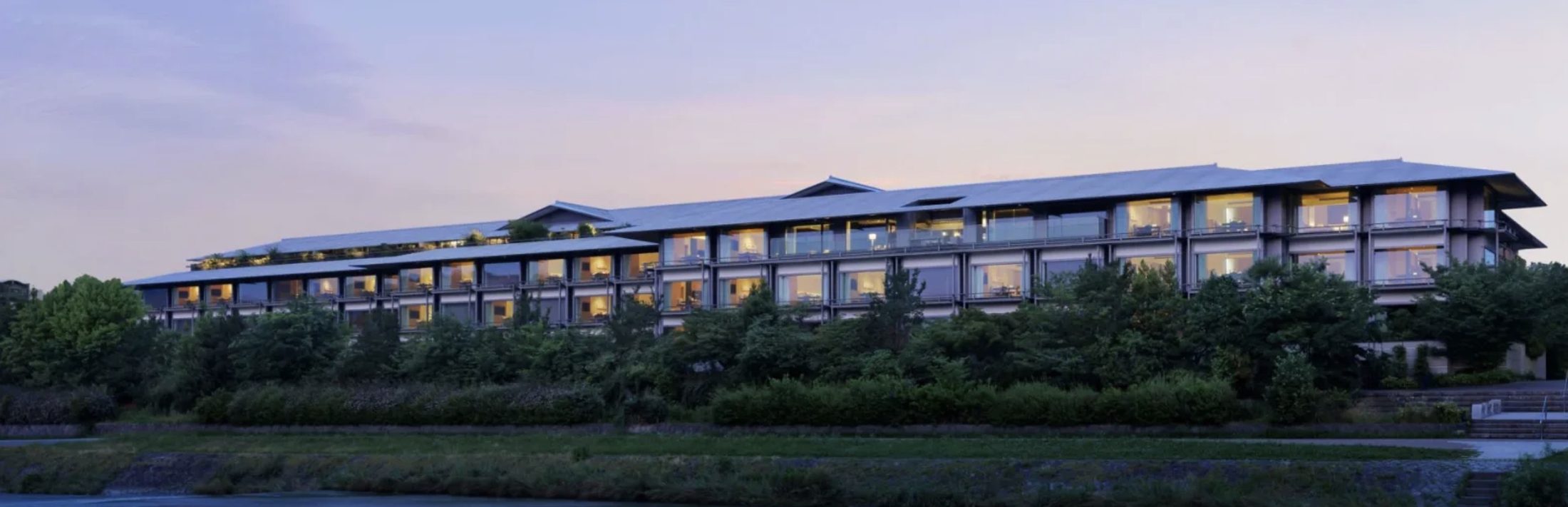 The Ritz-Carlton Kyoto at dusk along the Kamogawa River