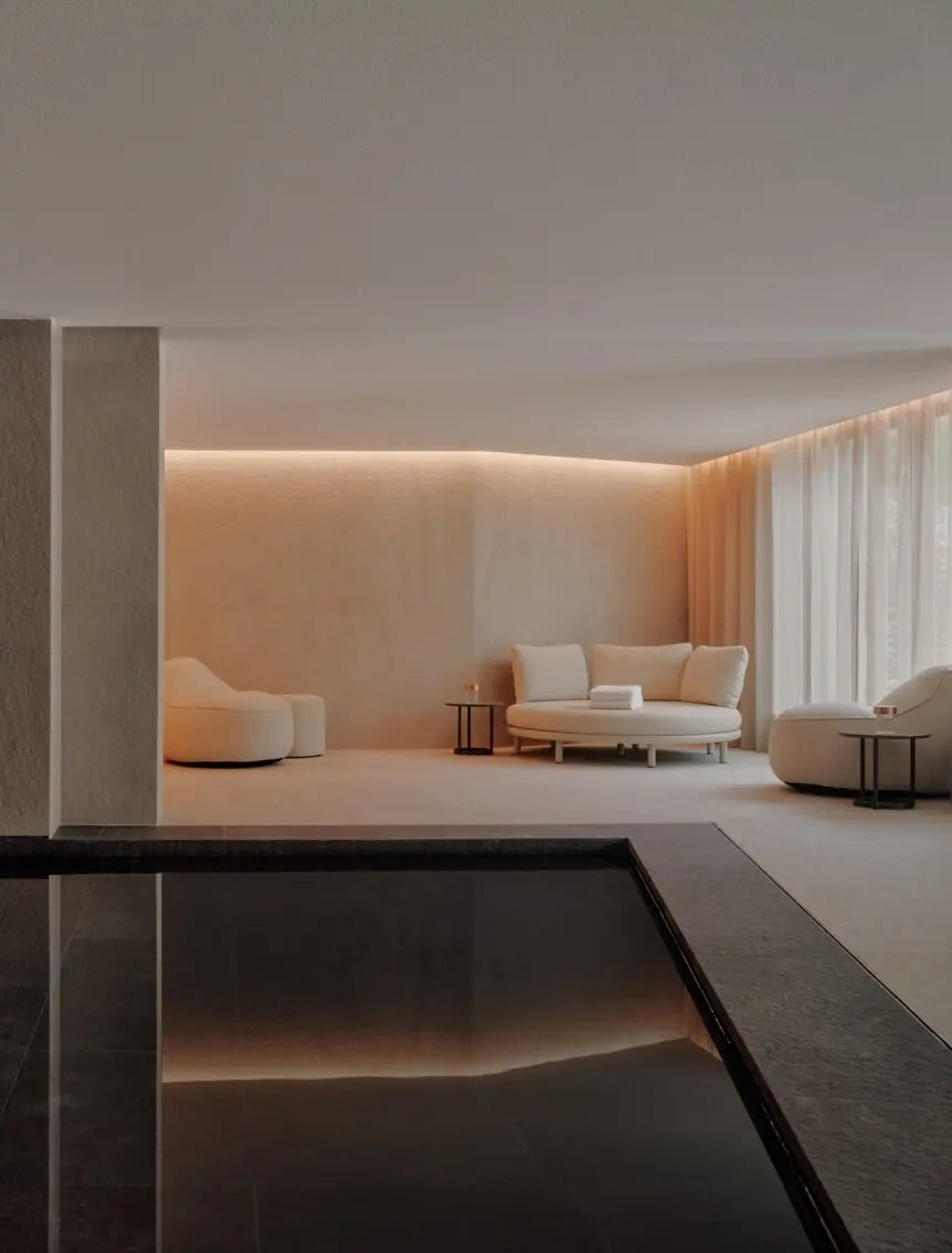 The softly lit indoor pool and relaxation area of the Aman Rosa Alpina spa