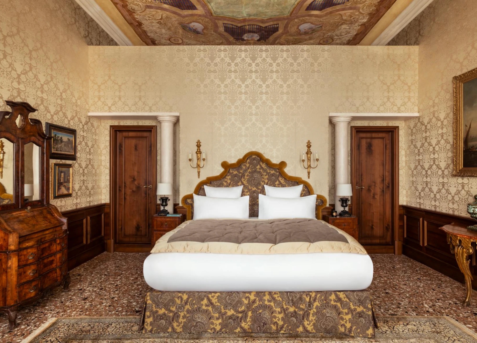A bedroom under a painted ceiling in the Suite del Doge, Airelles Palladio