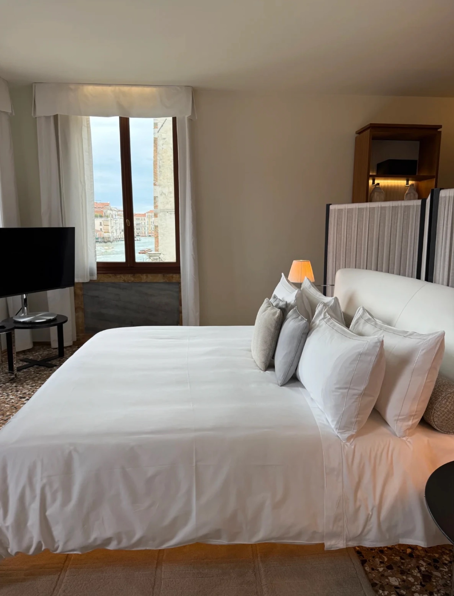 A bedroom looking onto the Grand Canal at Aman Venice