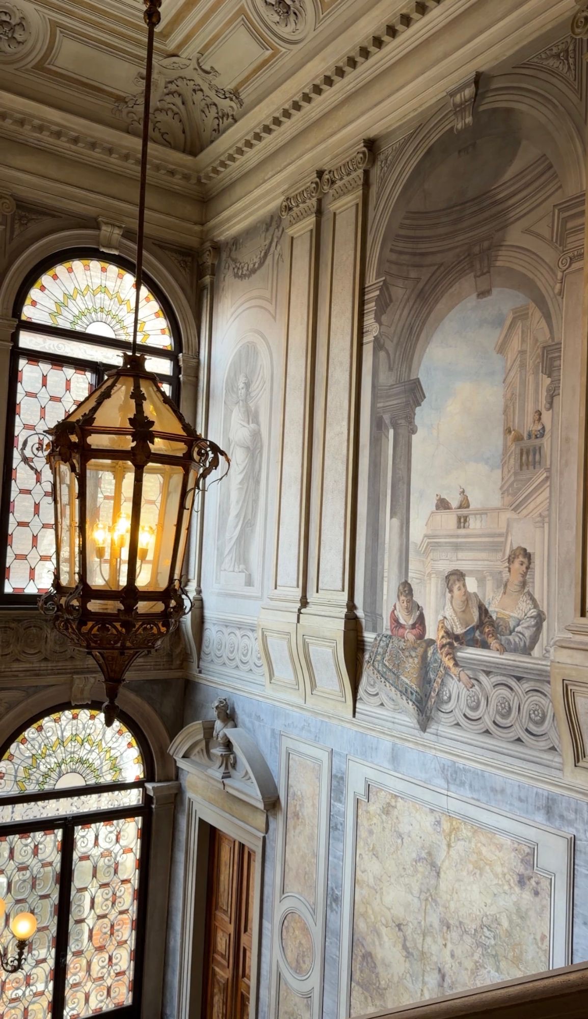 A frescoed staircase at Aman Venice