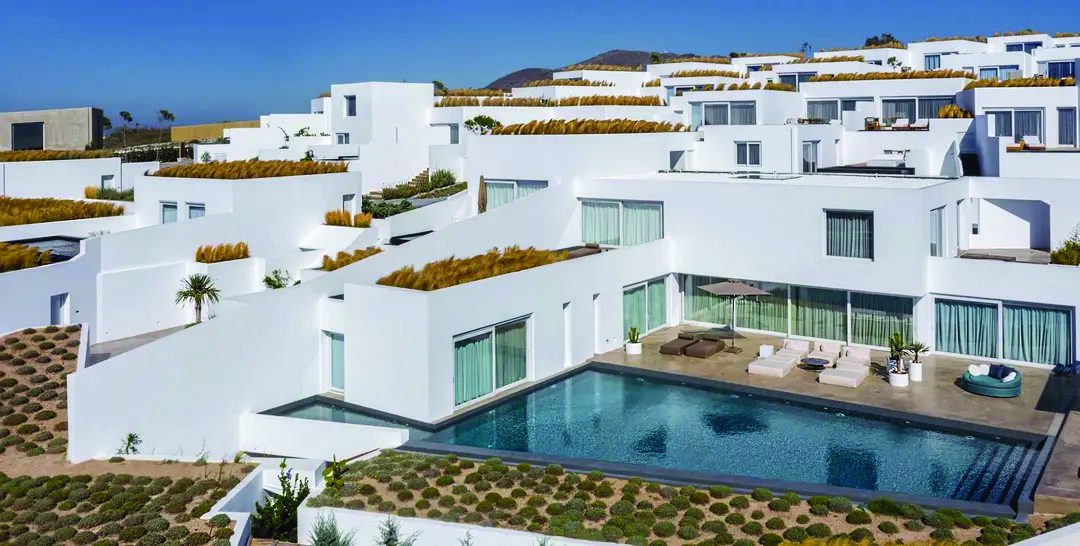 The Eden Villa and its private pool among the white buildings of Andronis Arcadia, Santorini