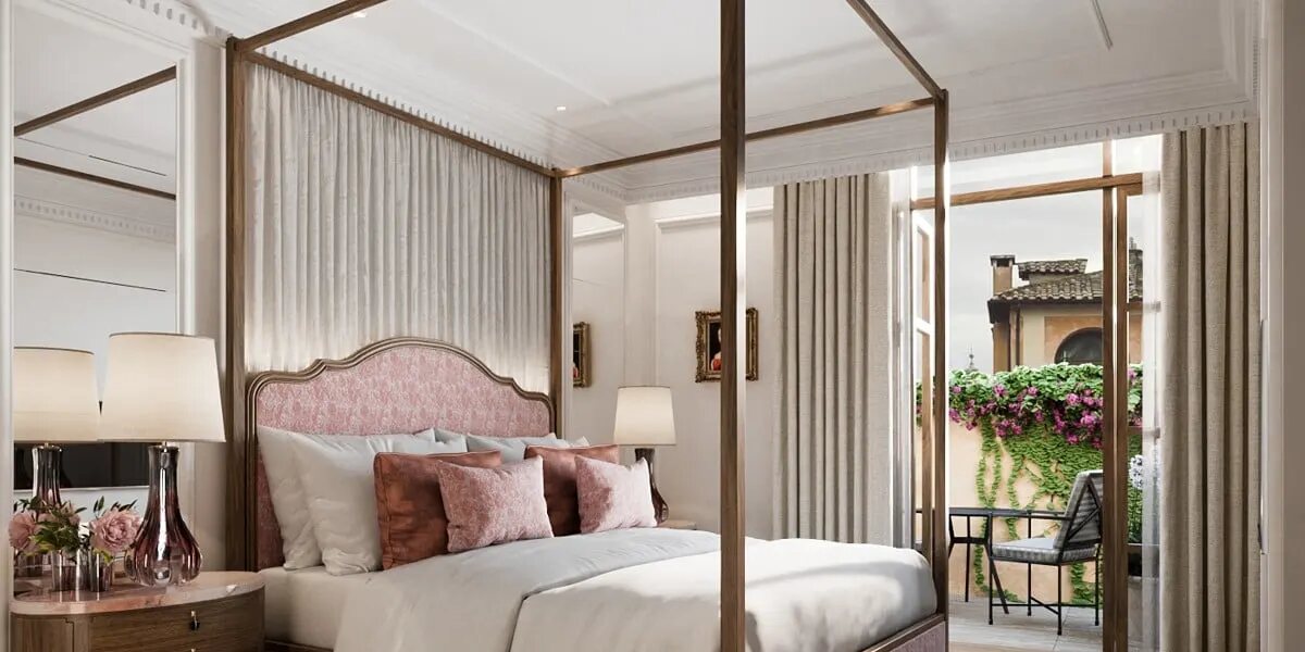 A Corinthia Rome bedroom with a bronze canopy bed, pink upholstered headboard and a terrace draped in bougainvillea
