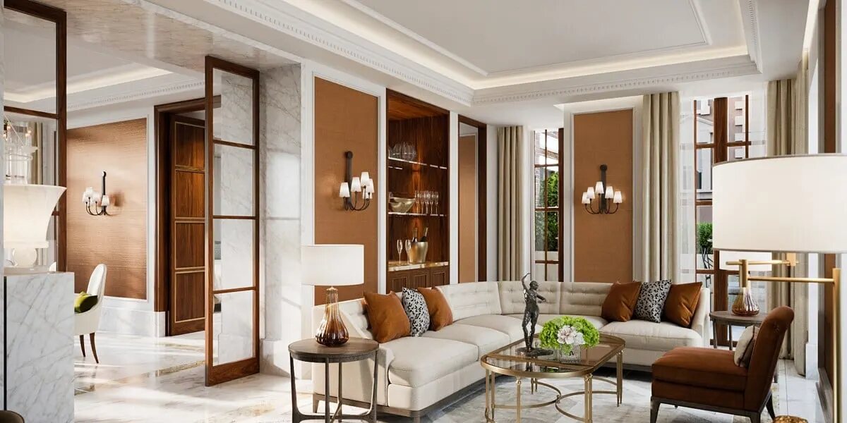 A Corinthia Rome suite living room with a white sofa, cognac leather accents, marble floors and a walnut bar