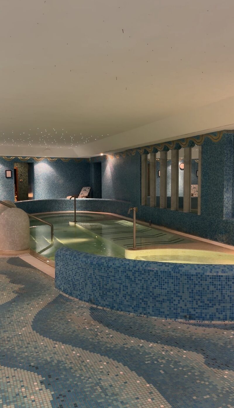 The indoor pool in the Hotel de Russie spa, tiled in blue mosaic under a starry ceiling