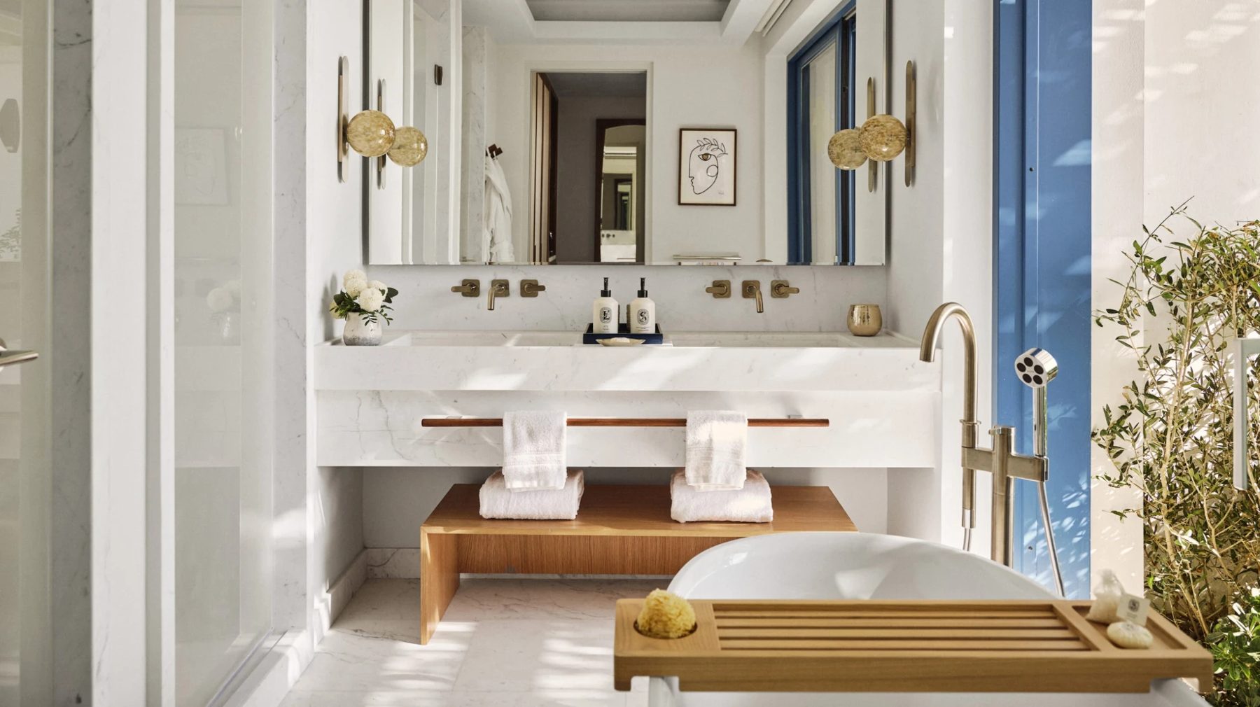 A marble bathroom with a freestanding tub at Four Seasons Hotel Mykonos