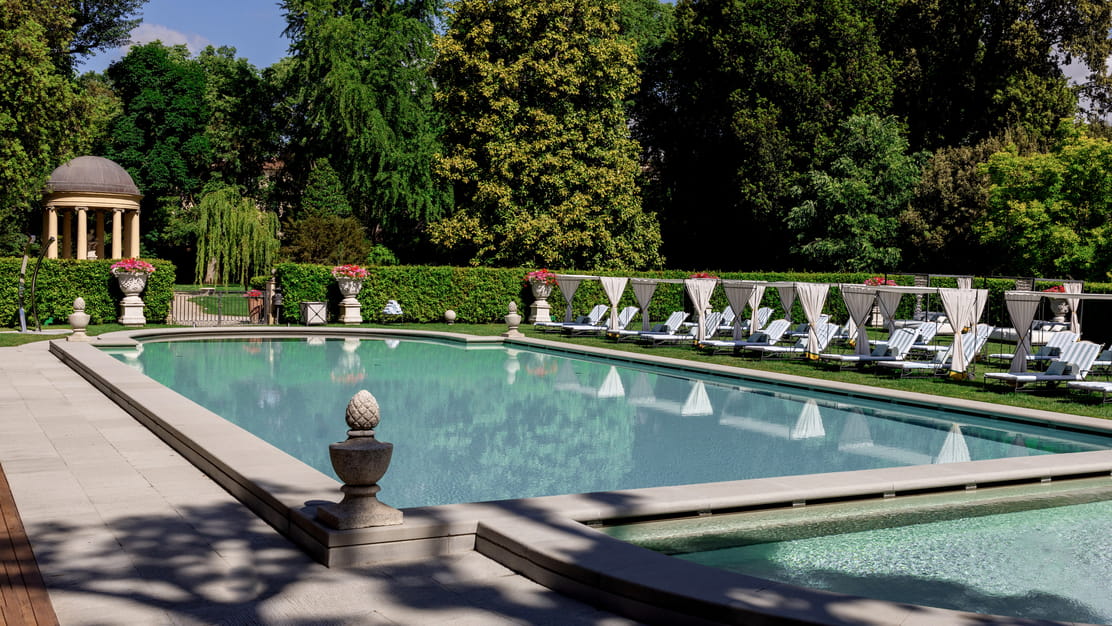 The garden pool with cabanas at Four Seasons Hotel Firenze