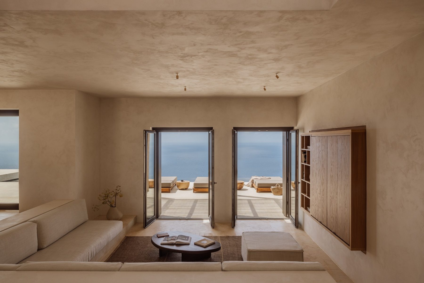 The living room of the Three-Bedroom Villa at Gundari, opening onto the terrace and sea