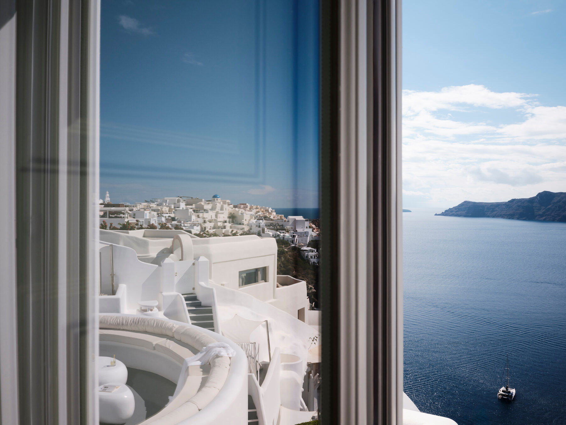 A catamaran on the caldera below Oia