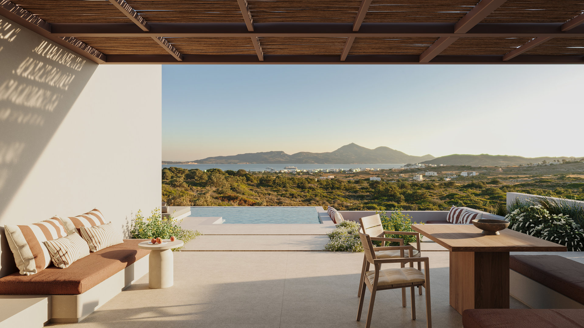Onero Milos — terraced suites above the sea at dusk