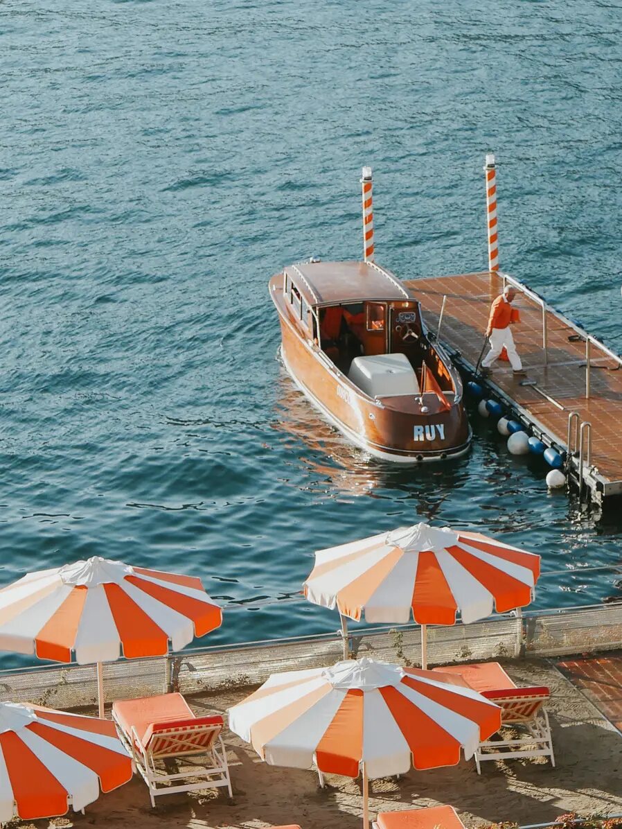 A wooden boat at Grand Hotel Tremezzo’s dock