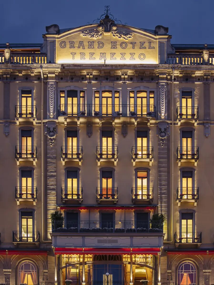 Grand Hotel Tremezzo’s facade lit up at dusk