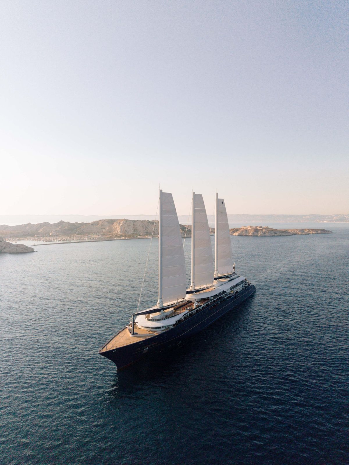 Orient Express Corinthian under three white sails off the coast near Marseille