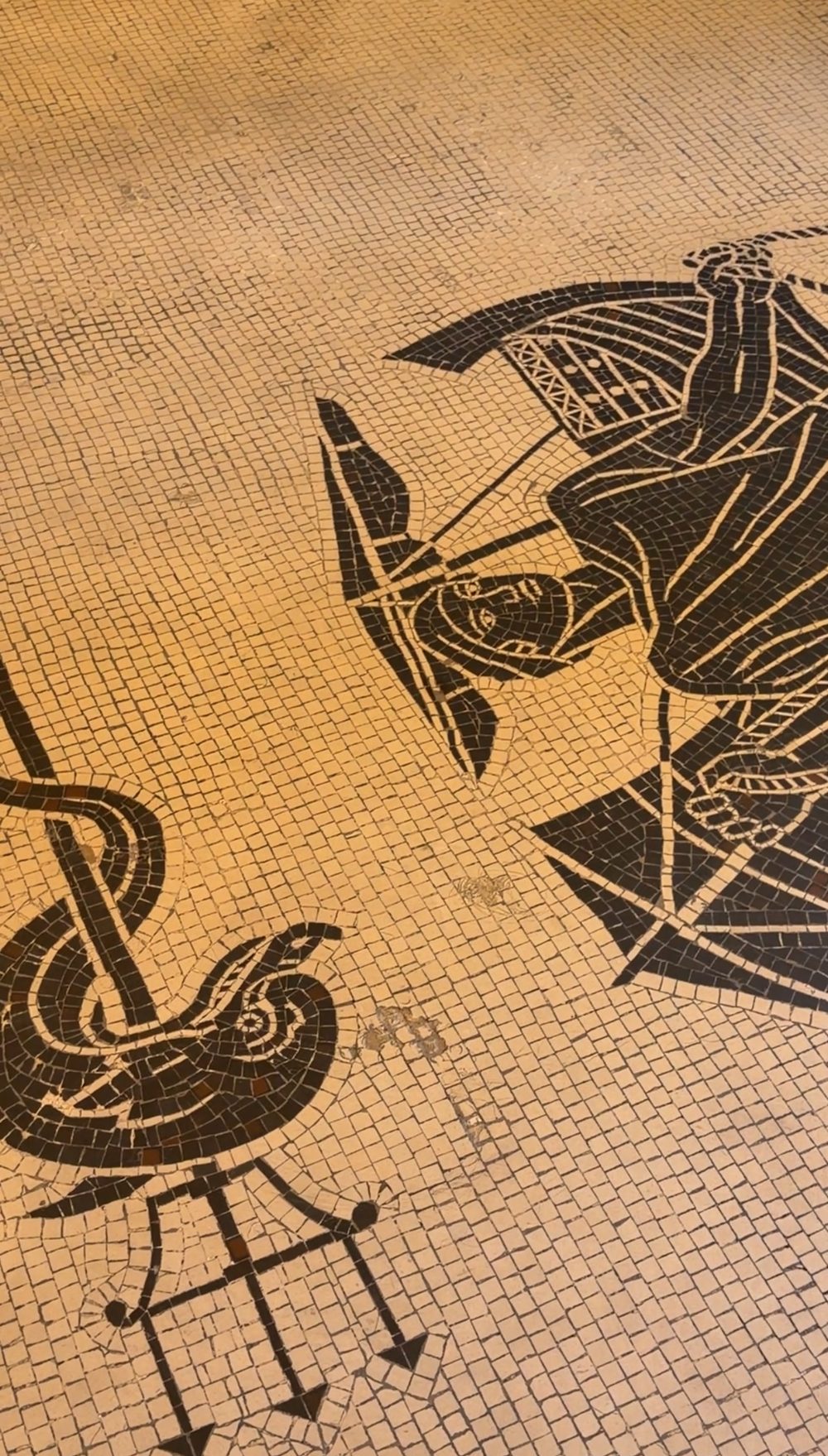 A black and gold mosaic floor in the La Dolce Vita lounge