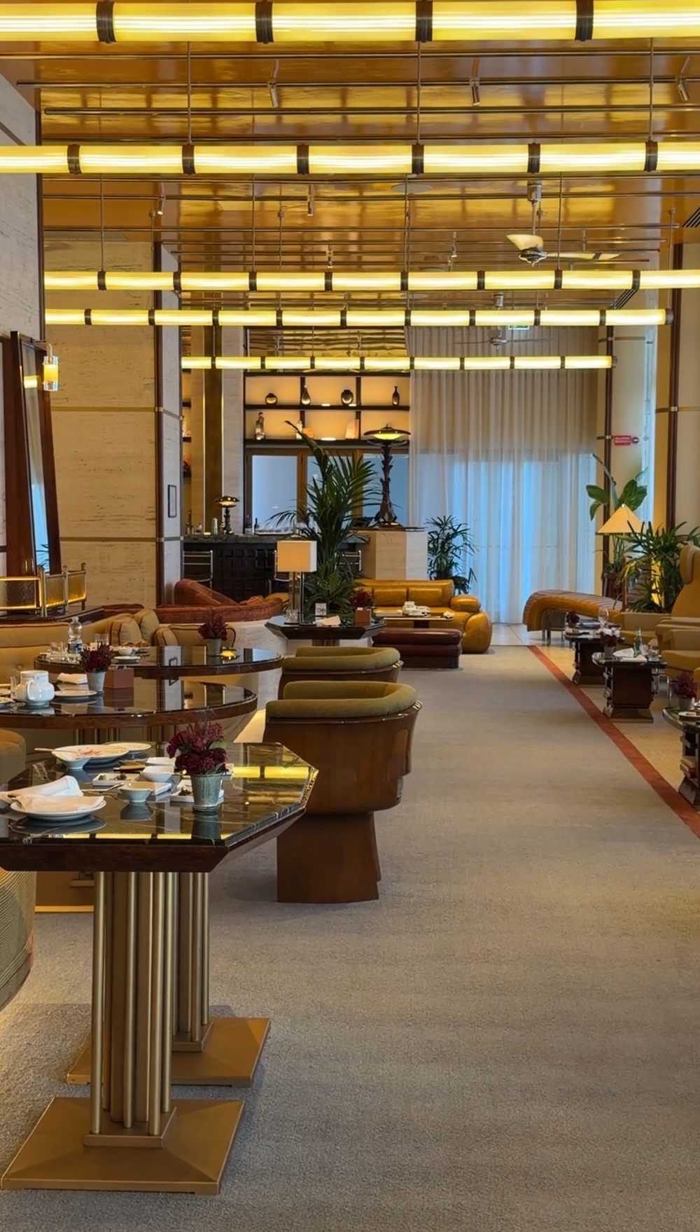 Velvet armchairs and marble tables in the La Dolce Vita lounge
