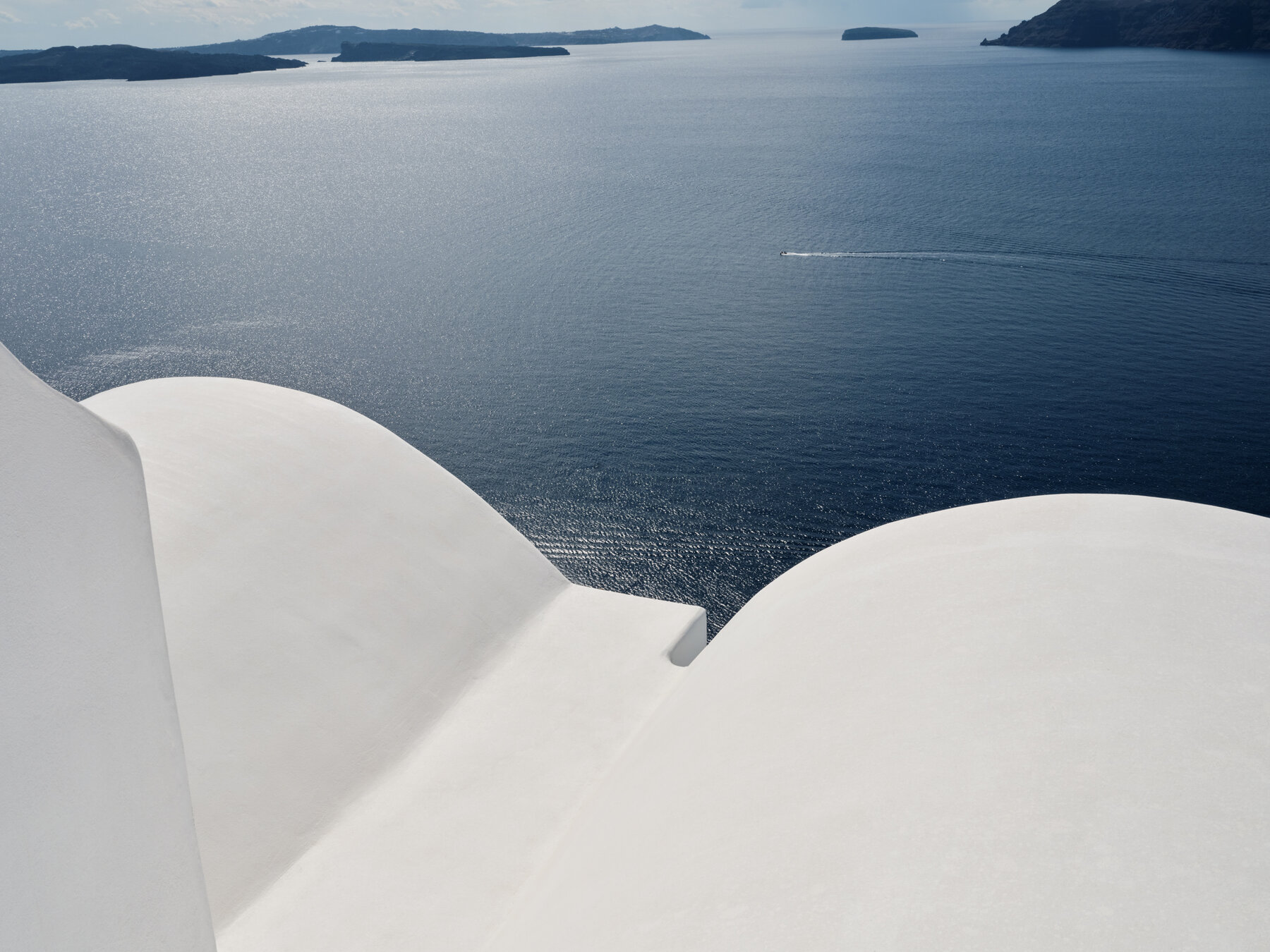 White Cycladic rooftops overlooking the Santorini caldera