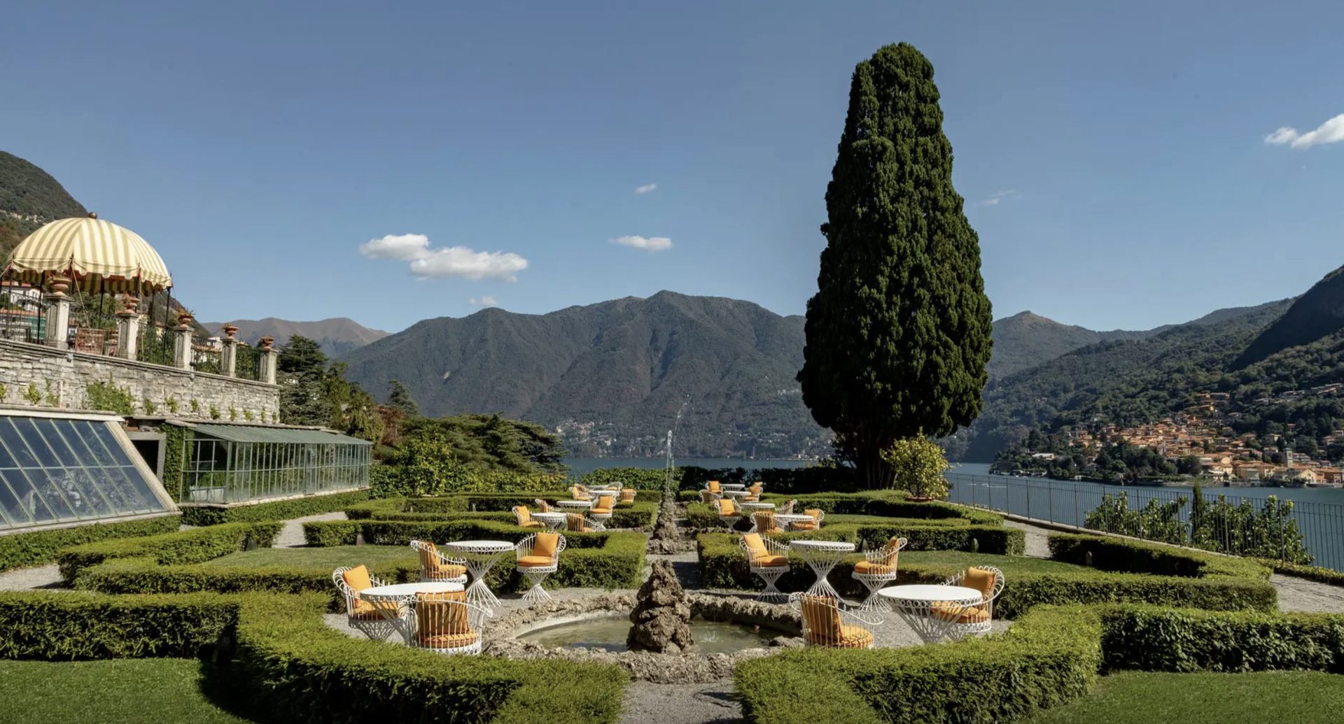 Passalacqua’s formal gardens with a fountain, a cypress and the lake beyond