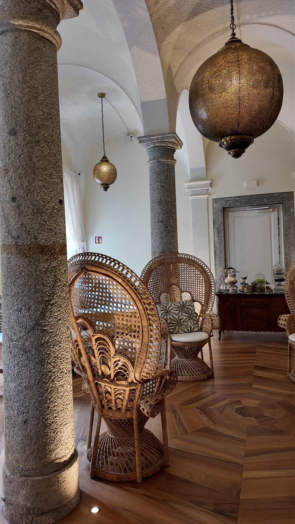 Passalacqua’s Moroccan-inspired spa lounge, with vaulted ceilings, stone columns, brass lanterns and peacock wicker chairs
